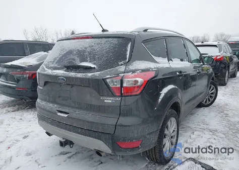 2017 Ford Escape Titanium z USA, uszkodzony, nr VIN 1FMCU9J99HUE89713